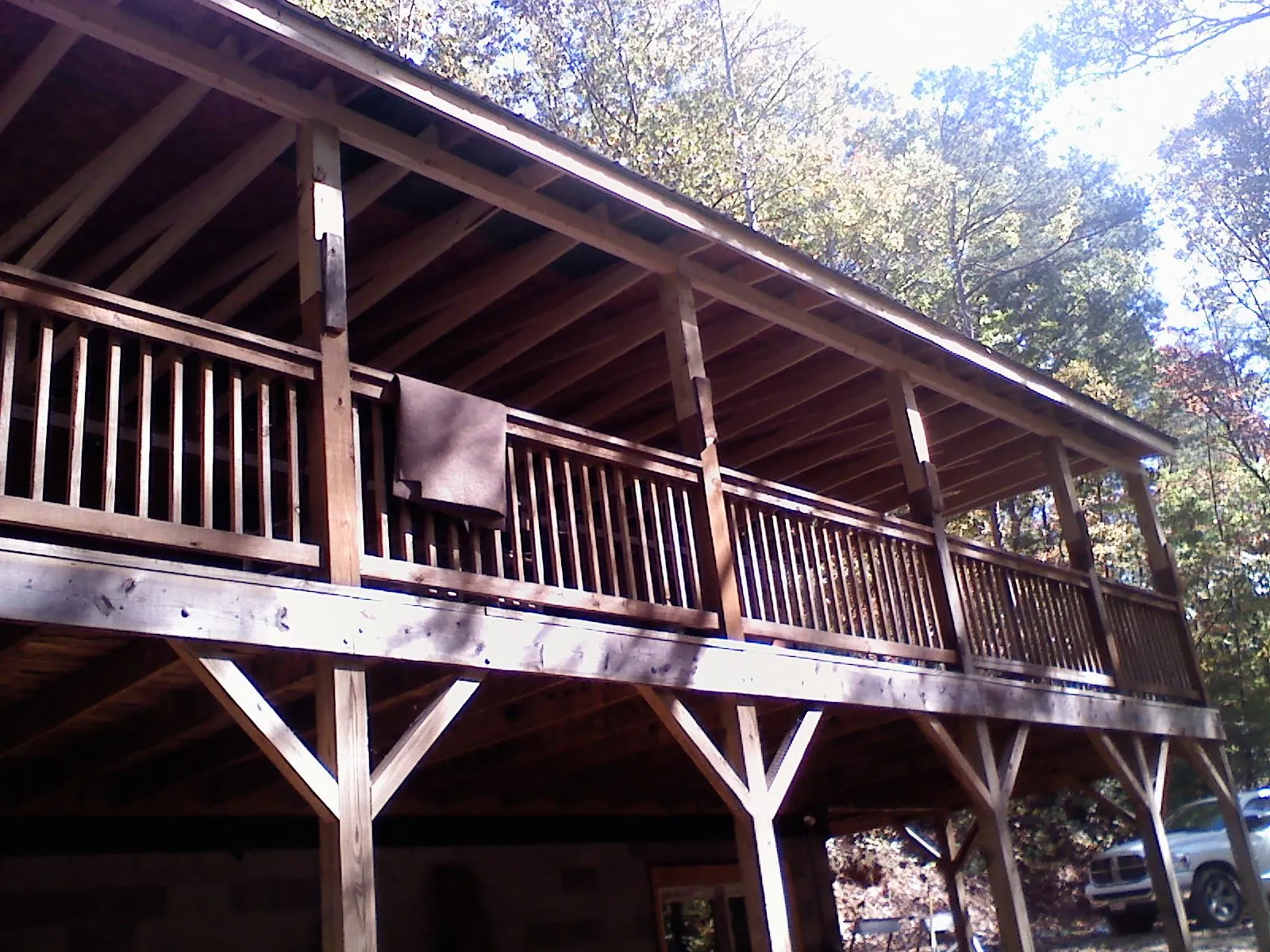 Timber framing under a new elevated porch and deck — Roof Leak Repair in River Edge by Roofing Brothers